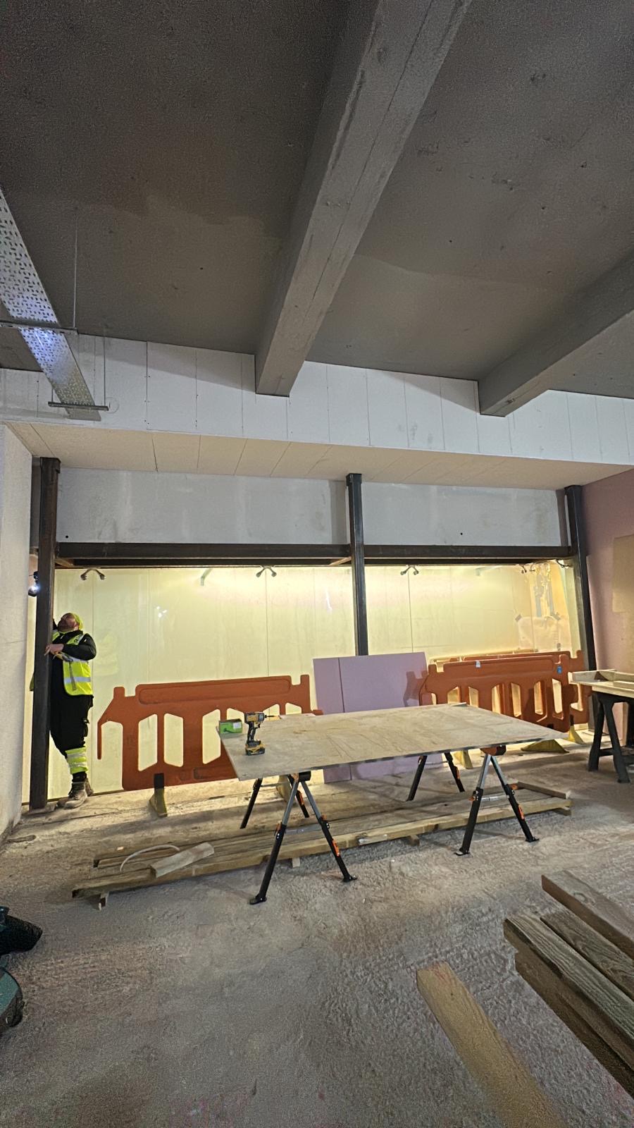 Fire-rated enclosure and soffit interface